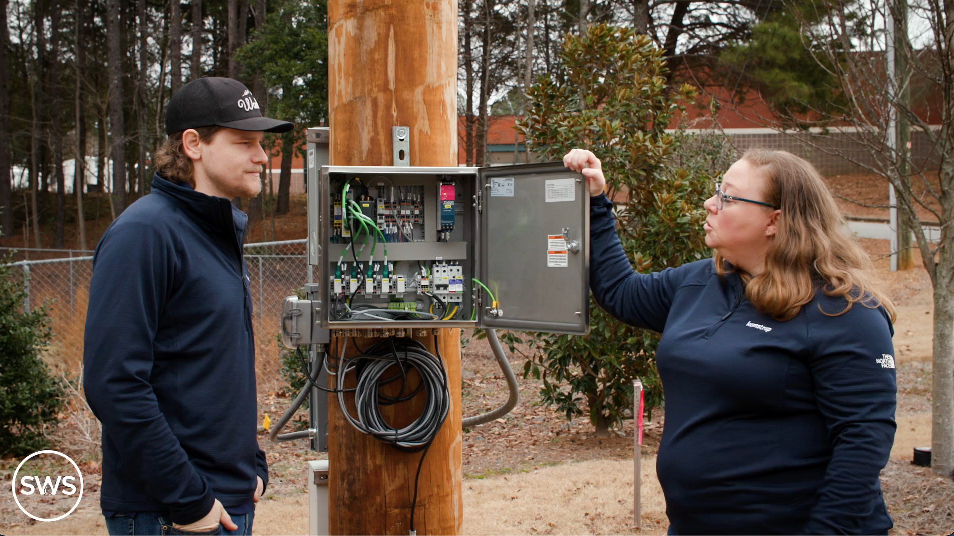 Technicians explain remote data collection box